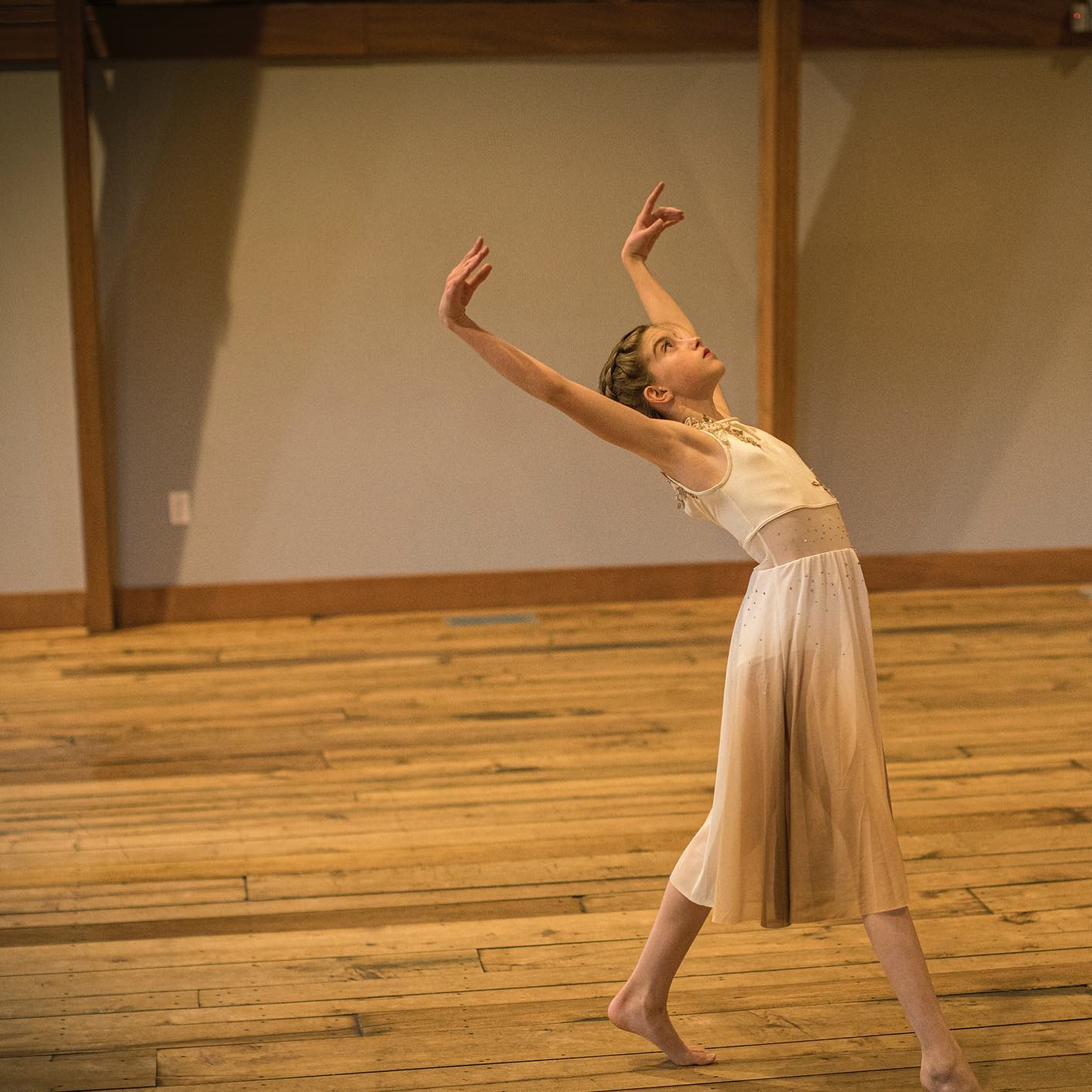 A member of the Design Dance Studio Teen Company performs a solo at the Cathedral Barns in Traverse City, Michigan for the studio's annual ART Convention & Competition.
